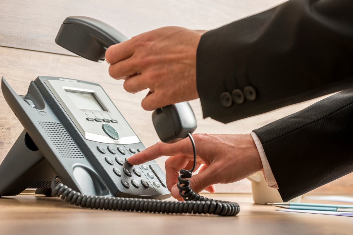 Communication Operator Dialing a Telephone Number